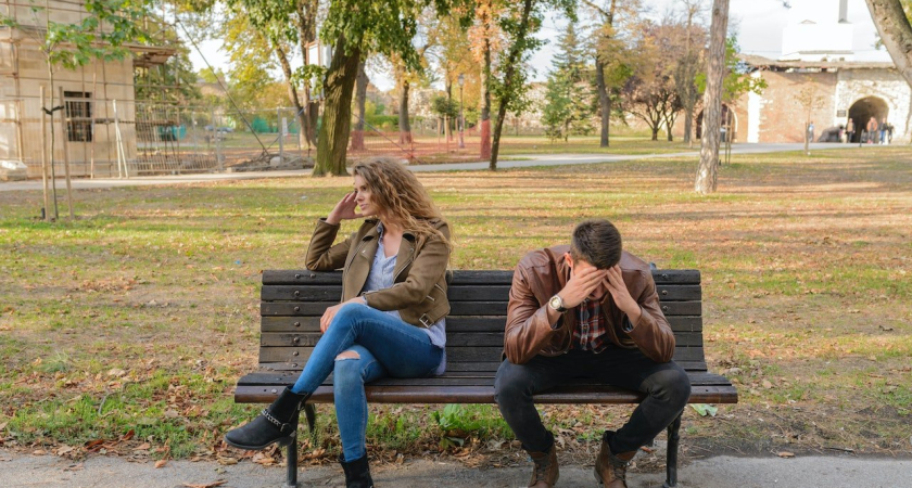 couple bickering on a bench