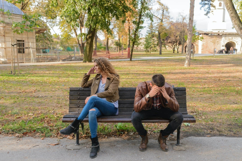 couple bickering on a bench